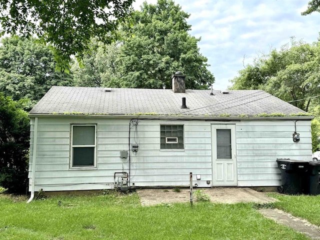 1106 W Rose St, South Bend, IN 46616 - back of property with a chimney and a lawn