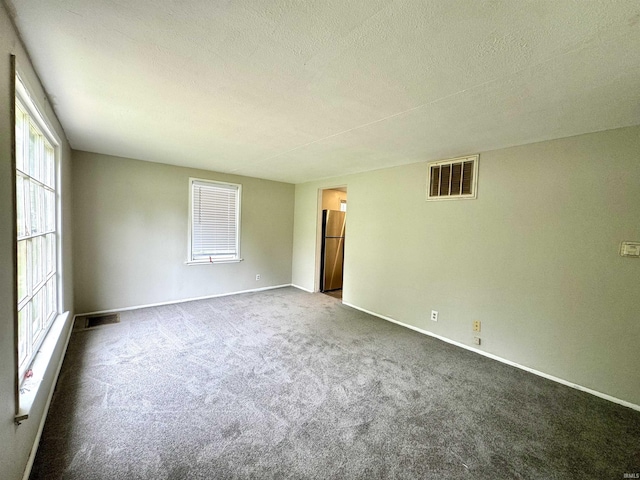 1106 W Rose St, South Bend, IN 46616 - unfurnished room featuring carpet floors and a textured ceiling