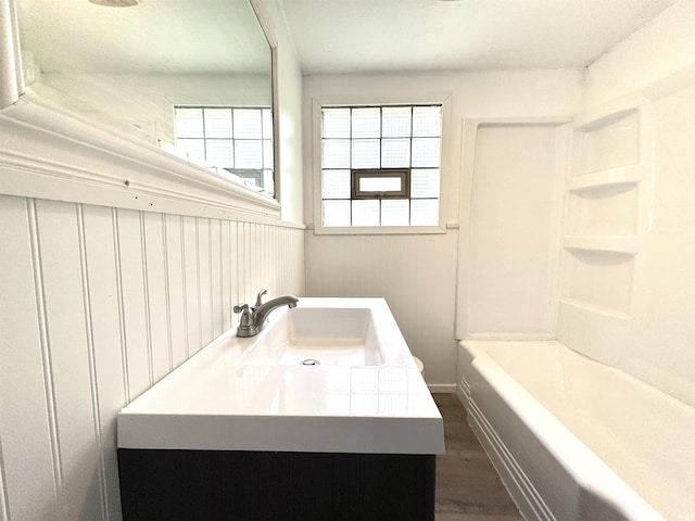 1106 W Rose St, South Bend, IN 46616 - full bathroom with vanity, plenty of natural light, wood finished floors, and shower / bath combination