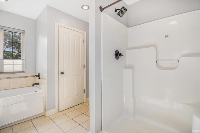 11999 Loughlin Dr, Mishawaka, IN 46545 - full bath with tile patterned floors, a shower stall, and a garden tub