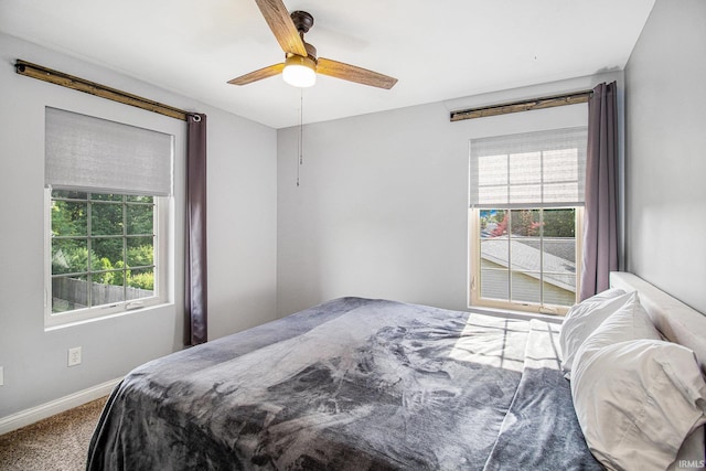 11999 Loughlin Dr, Mishawaka, IN 46545 - carpeted bedroom featuring baseboards and ceiling fan