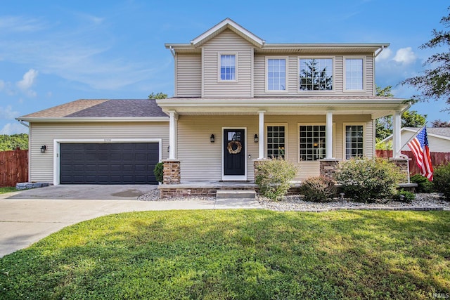 11999 Loughlin Dr, Mishawaka, IN 46545 - view of front facade featuring driveway, an attached garage, and a porch