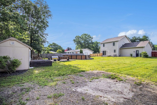 11999 Loughlin Dr, Mishawaka, IN 46545 - fenced backyard featuring a vegetable garden
