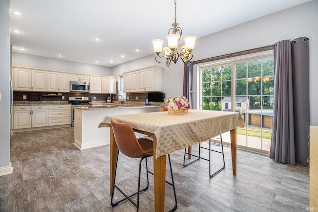 11999 Loughlin Dr, Mishawaka, IN 46545 - dining room featuring a chandelier, light wood-style flooring, and recessed lighting