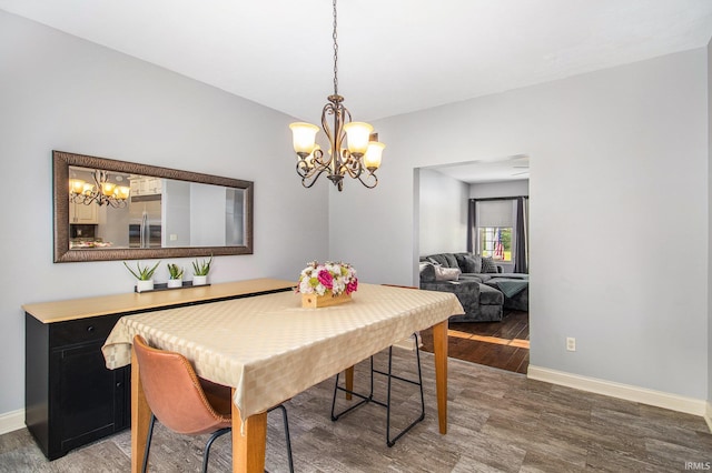 11999 Loughlin Dr, Mishawaka, IN 46545 - dining room featuring a chandelier and light wood-style flooring