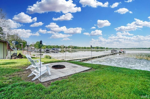 1049 Chapman Lake Dr, Warsaw, IN 46582 - dock area featuring an outdoor fire pit, a yard, and a water view