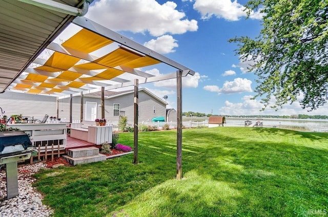 1049 Chapman Lake Dr, Warsaw, IN 46582 - view of grassy yard with a pergola and a deck with water view