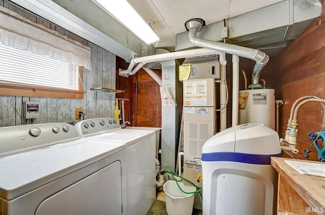 1049 Chapman Lake Dr, Warsaw, IN 46582 - laundry room featuring independent washer and dryer, water heater, and wooden walls