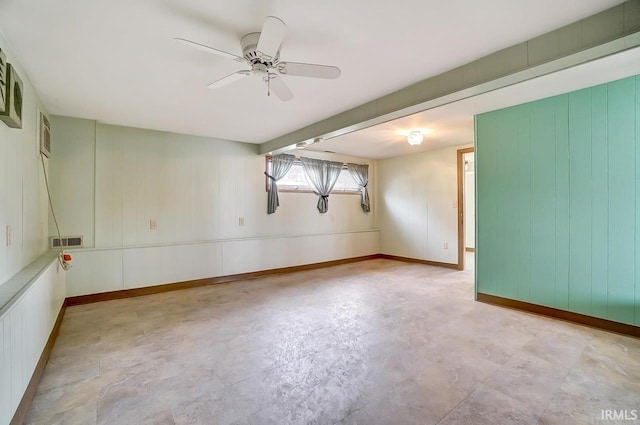 1049 Chapman Lake Dr, Warsaw, IN 46582 - empty room with a ceiling fan and wooden walls