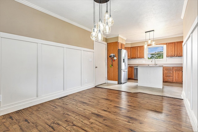 51268 Channel Ct, Elkhart, IN 46514 - kitchen with stainless steel fridge with ice dispenser, a decorative wall, open floor plan, brown cabinets, and light countertops
