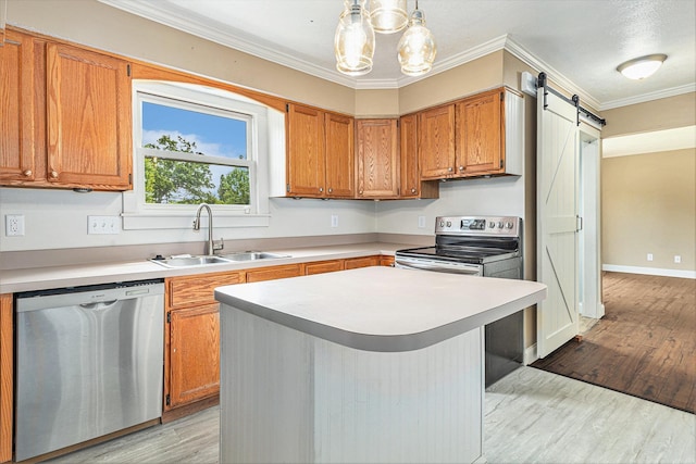 51268 Channel Ct, Elkhart, IN 46514 - kitchen with stainless steel appliances, light countertops, a barn door, light wood-style floors, and ornamental molding