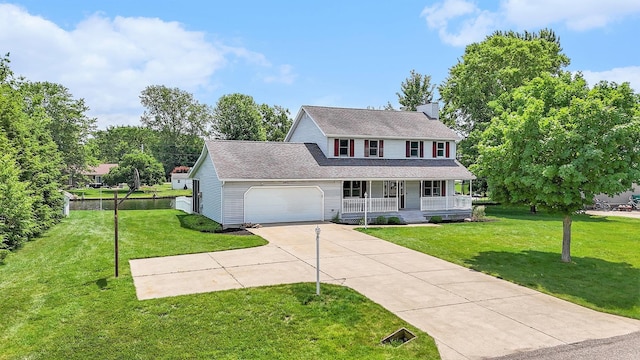 51268 Channel Ct, Elkhart, IN 46514 - view of front facade with a porch, a front yard, driveway, an attached garage, and a chimney