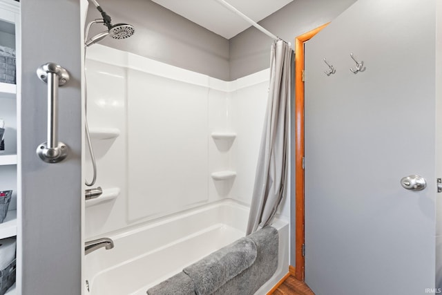1123 E Gump Rd, Fort Wayne, IN 46845 - bathroom with shower / bathtub combination with curtain and wood finished floors