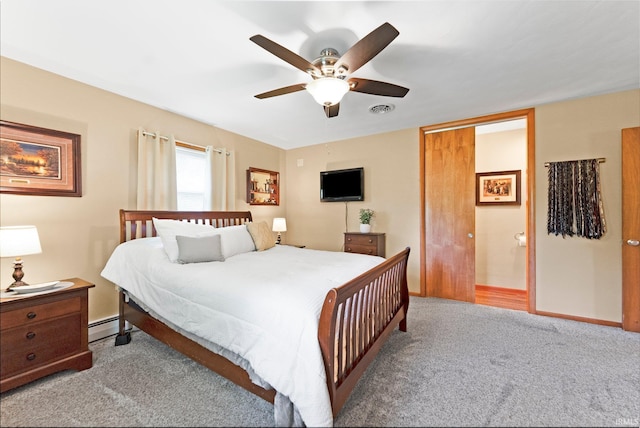 1123 E Gump Rd, Fort Wayne, IN 46845 - carpeted bedroom with a baseboard heating unit and a ceiling fan