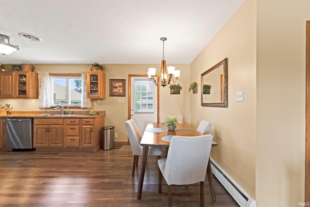 1123 E Gump Rd, Fort Wayne, IN 46845 - dining space with a baseboard heating unit, a chandelier, plenty of natural light, and dark wood finished floors