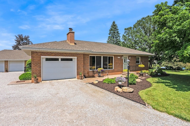 1123 E Gump Rd, Fort Wayne, IN 46845 - ranch-style house featuring brick siding, a chimney, a front yard, a garage, and gravel driveway
