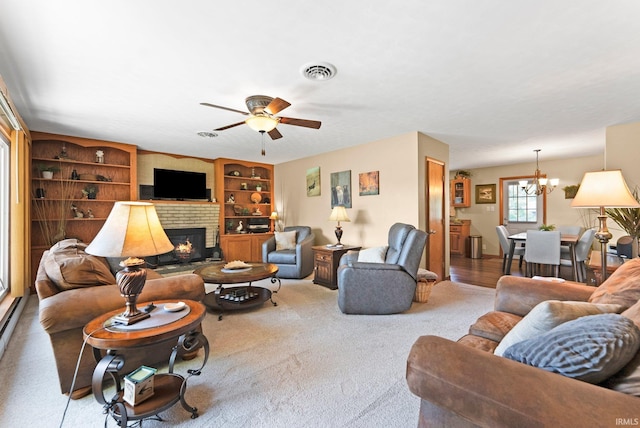 1123 E Gump Rd, Fort Wayne, IN 46845 - living room featuring a brick fireplace, a ceiling fan, a chandelier, carpet, and built in features