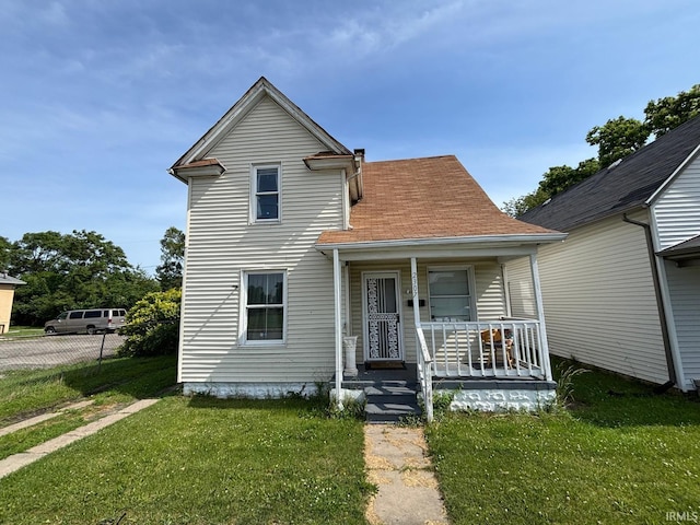 2307 Linden Ave, South Bend, IN 46628 - traditional home featuring covered porch and roof with shingles