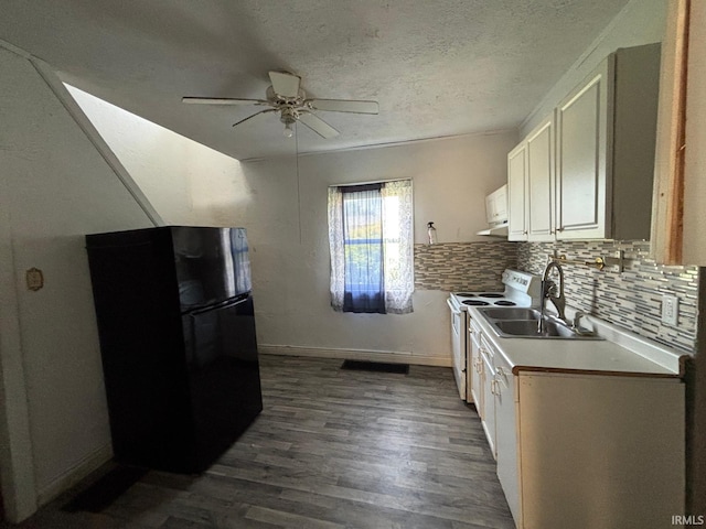 2307 Linden Ave, South Bend, IN 46628 - kitchen with freestanding refrigerator, electric range, a ceiling fan, dark wood-style flooring, and tasteful backsplash