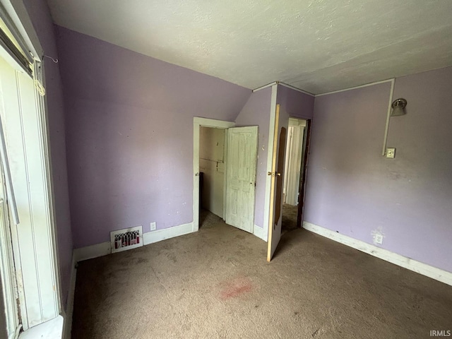 2307 Linden Ave, South Bend, IN 46628 - unfurnished bedroom featuring carpet and lofted ceiling