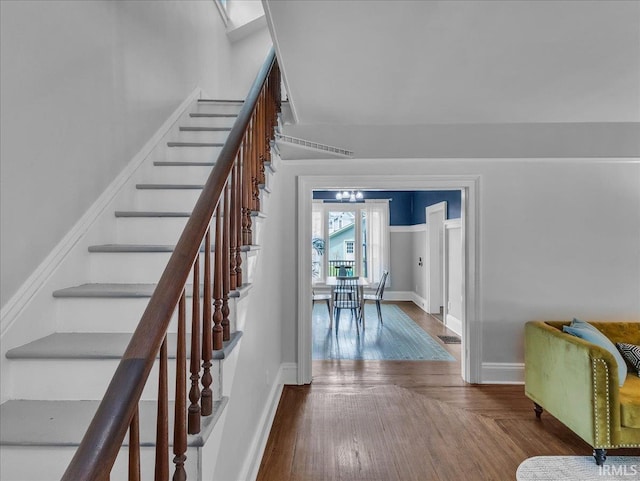 1310 W Jefferson Blvd, Fort Wayne, IN 46802 - staircase with baseboards and wood finished floors