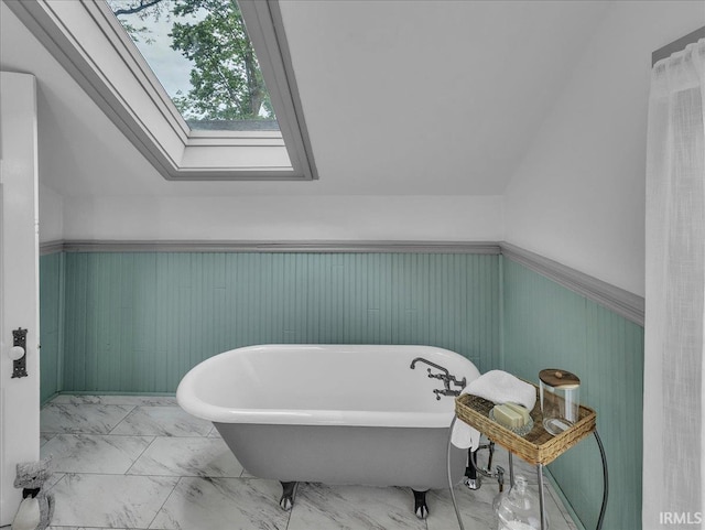 1310 W Jefferson Blvd, Fort Wayne, IN 46802 - bathroom with a skylight, wainscoting, a freestanding bath, and marble finish floors