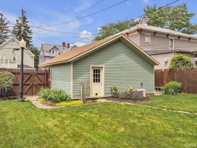 1310 W Jefferson Blvd, Fort Wayne, IN 46802 - rear view of property with a chimney and roof with shingles