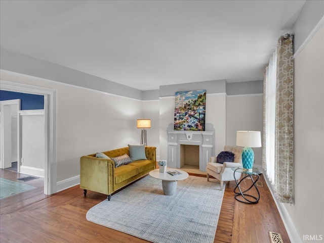 1310 W Jefferson Blvd, Fort Wayne, IN 46802 - living room with wood finished floors and a fireplace