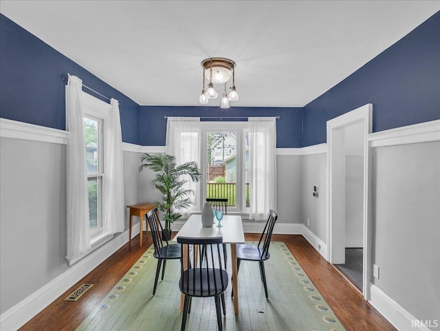 1310 W Jefferson Blvd, Fort Wayne, IN 46802 - dining room featuring a chandelier and wood-type flooring