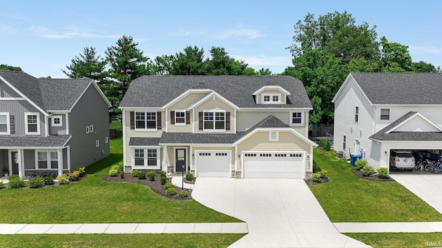 1114 Mosaic St, Huntertown, IN 46748 - view of front facade featuring concrete driveway, a front yard, stone siding, and a shingled roof