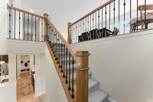 1114 Mosaic St, Huntertown, IN 46748 - stairs featuring wood finished floors and a high ceiling