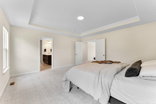 1114 Mosaic St, Huntertown, IN 46748 - bedroom featuring a raised ceiling, light colored carpet, ornamental molding, and ensuite bath