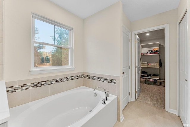 1114 Mosaic St, Huntertown, IN 46748 - full bath with a garden tub, a walk in closet, and tile patterned flooring