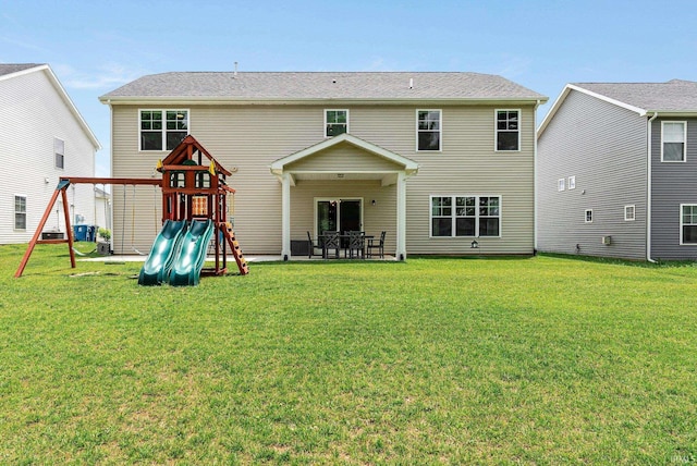 1114 Mosaic St, Huntertown, IN 46748 - back of house with a playground and a yard
