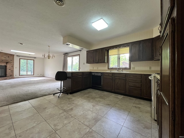 1140 Carlisle Dr, Jasper, IN 47546 - kitchen featuring open floor plan, black dishwasher, light colored carpet, a peninsula, and light countertops