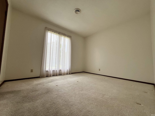 1140 Carlisle Dr, Jasper, IN 47546 - spare room featuring light carpet and baseboards