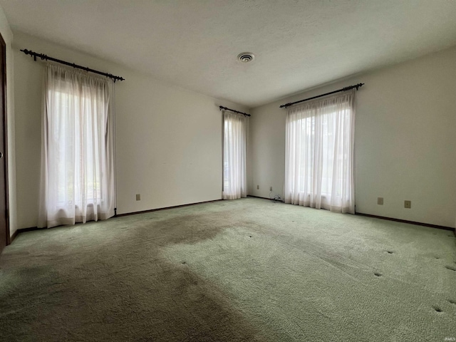 1140 Carlisle Dr, Jasper, IN 47546 - empty room featuring healthy amount of natural light and carpet floors