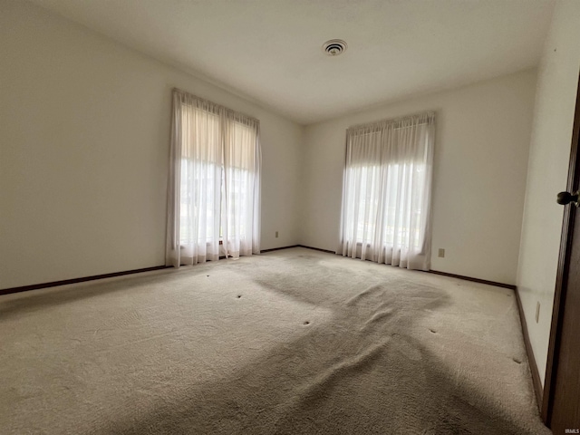 1140 Carlisle Dr, Jasper, IN 47546 - spare room featuring baseboards and light carpet