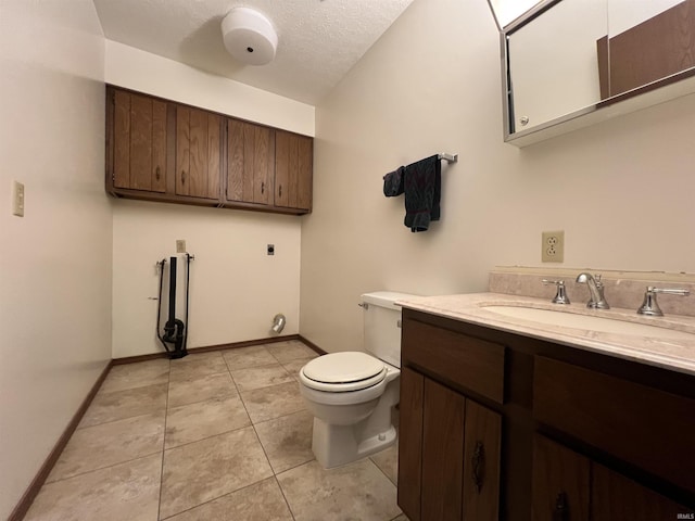 1140 Carlisle Dr, Jasper, IN 47546 - half bath with vanity, tile patterned flooring, and a textured ceiling
