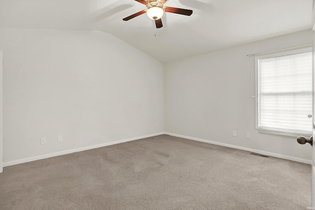 5972 N Ajuga Ct, Ellettsville, IN 47429 - spare room featuring ceiling fan, carpet, and vaulted ceiling