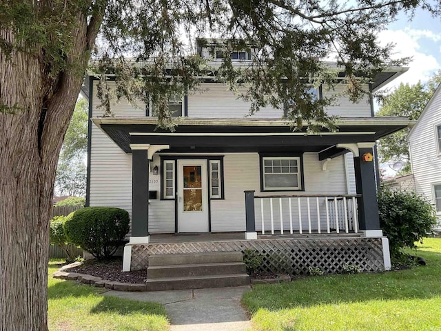 2103 Kentucky Ave, Fort Wayne, IN 46805 - view of front facade featuring a porch and a front lawn
