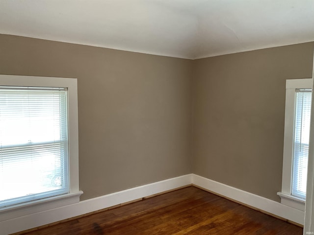 2103 Kentucky Ave, Fort Wayne, IN 46805 - unfurnished room featuring dark wood-type flooring and baseboards