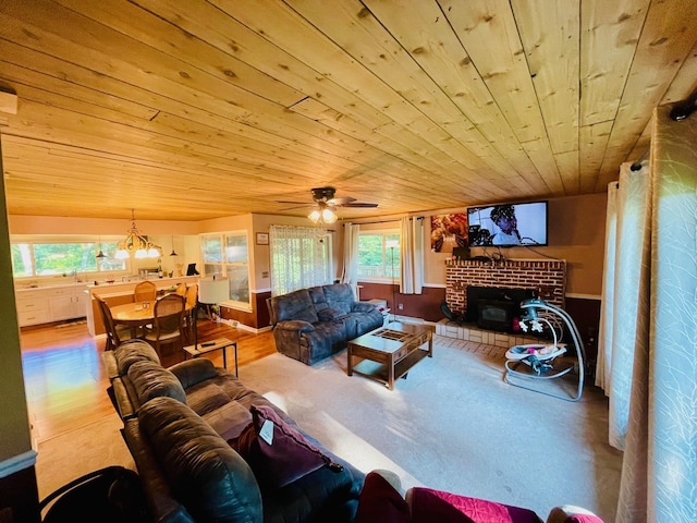 7640 Union Rd, Plymouth, IN 46563 - living room featuring wooden ceiling, plenty of natural light, a ceiling fan, a chandelier, and wood finished floors