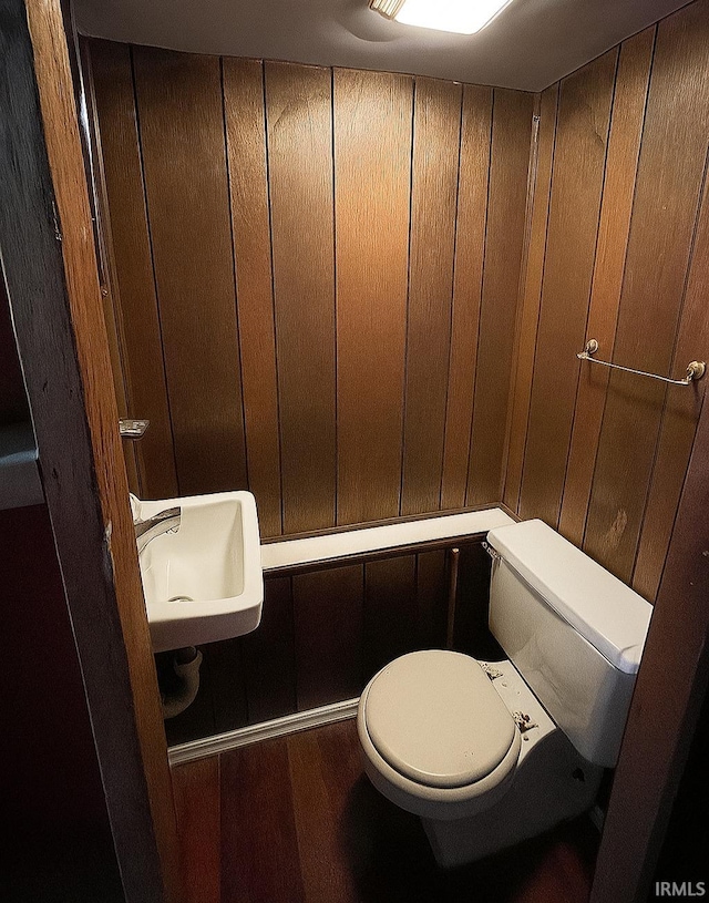 2056 Riedmiller Ave, Fort Wayne, IN 46802 - bathroom featuring wood finished floors and wooden walls