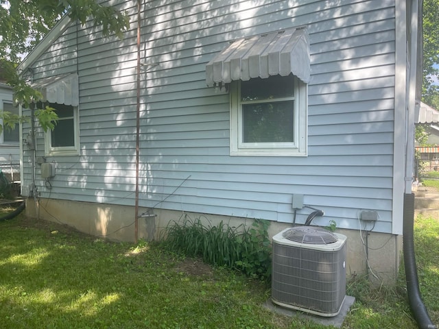 2056 Riedmiller Ave, Fort Wayne, IN 46802 - view of property exterior with a central air condition unit and a yard
