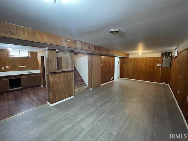 2056 Riedmiller Ave, Fort Wayne, IN 46802 - basement featuring wood finished floors, electric panel, wooden walls, and stairs