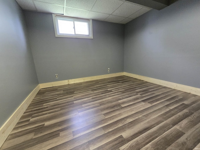 410 NW 2nd St, Washington, IN 47501 - below grade area with a paneled ceiling and dark wood-type flooring