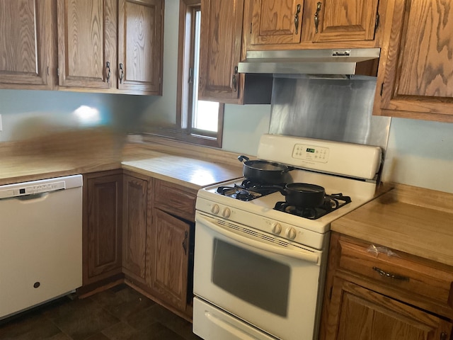 827 21st St, Logansport, IN 46947 - kitchen featuring white appliances, under cabinet range hood, and brown cabinets