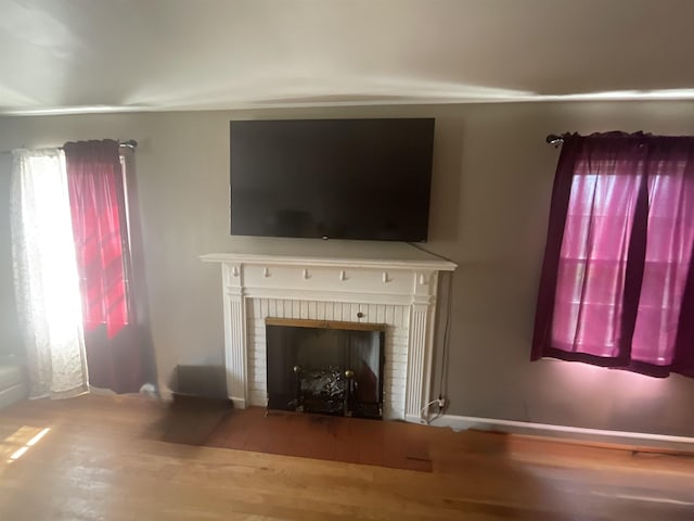 3001 S Pennsylvania Ave, Logansport, IN 46947 - living area with a brick fireplace and wood finished floors