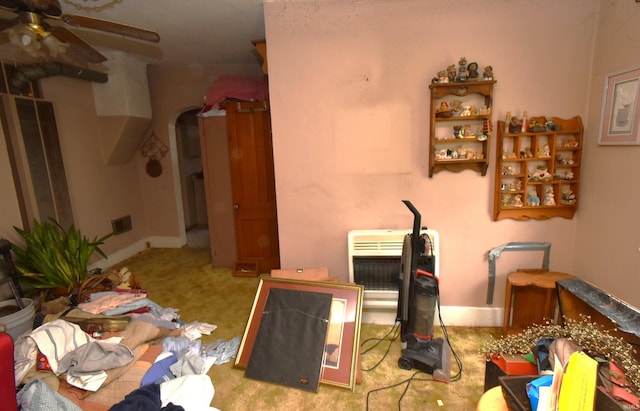 102 S Foster St, Boswell, IN 47921 - misc room featuring carpet floors, a ceiling fan, heating unit, and arched walkways